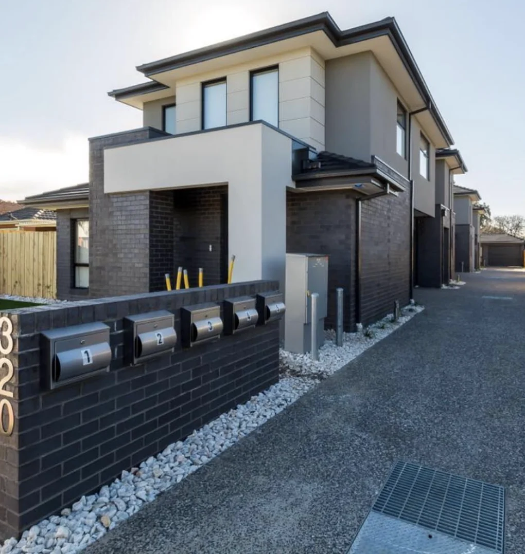 Five multi unit homes in Pascoe Vale South, with pale upper cladding and dark brickwork