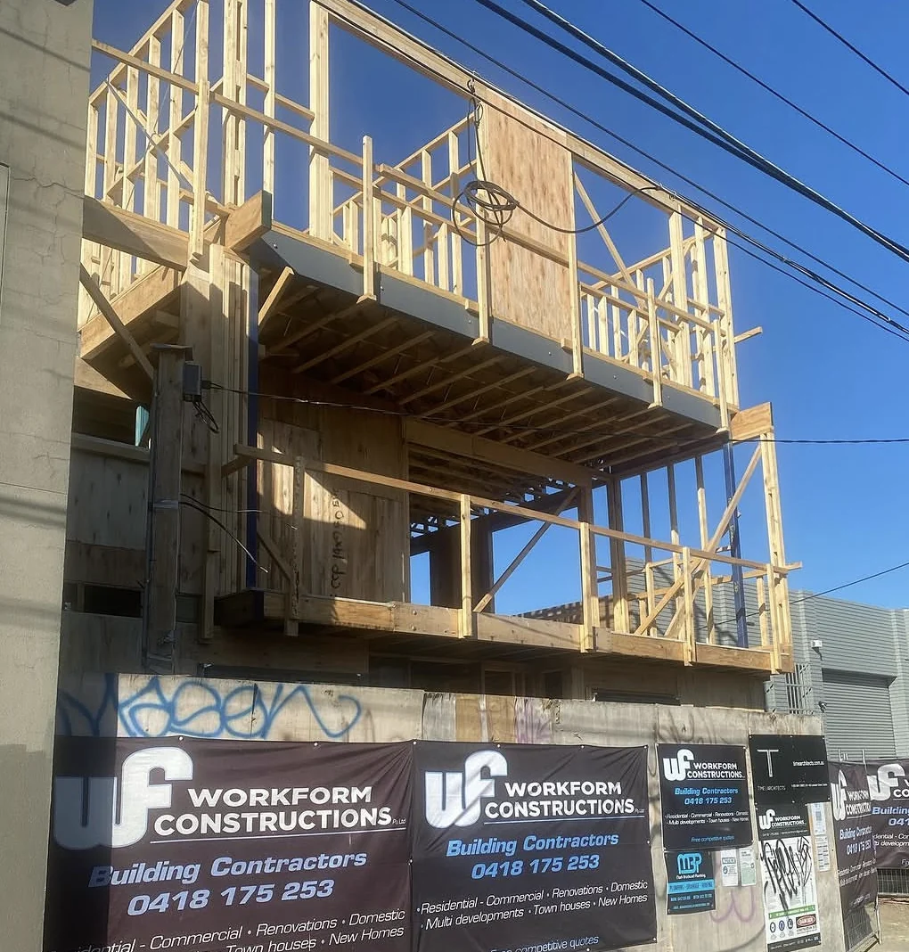 Timber frame nearly complete at a Workform residential site, with brickwork underway