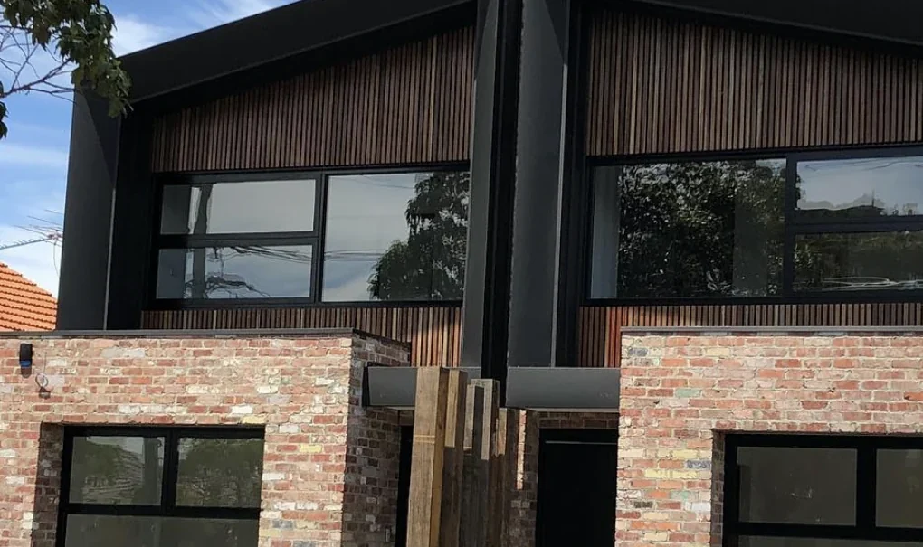 Two adjoining brick and timber townhouses in Brunswick