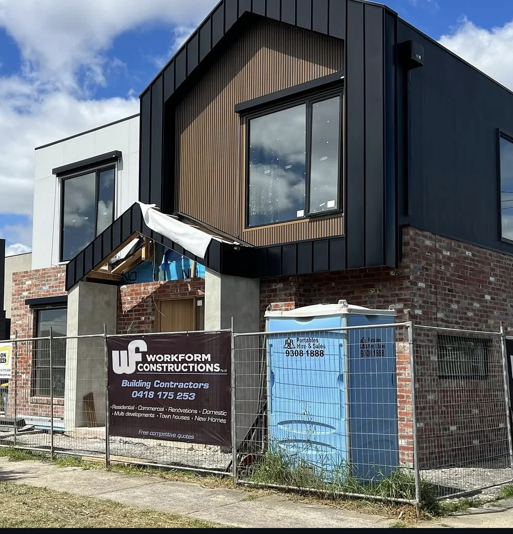 Project McLean with dark cladding and brickwork